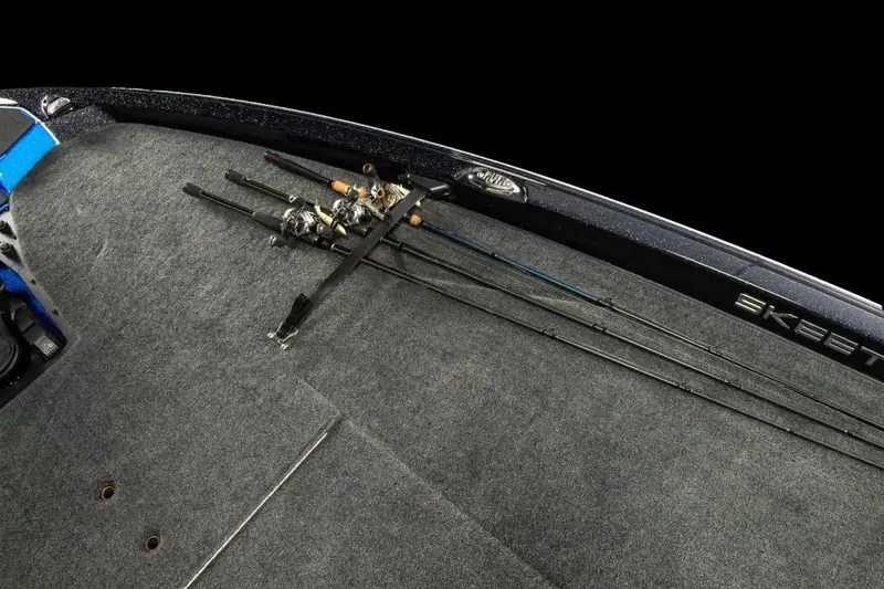 Slide: The Image of Manufacturer Provided Image: 2026 Skeeter ZXE20 boat deck with fishing rods secured on carpeted surface. - 26
