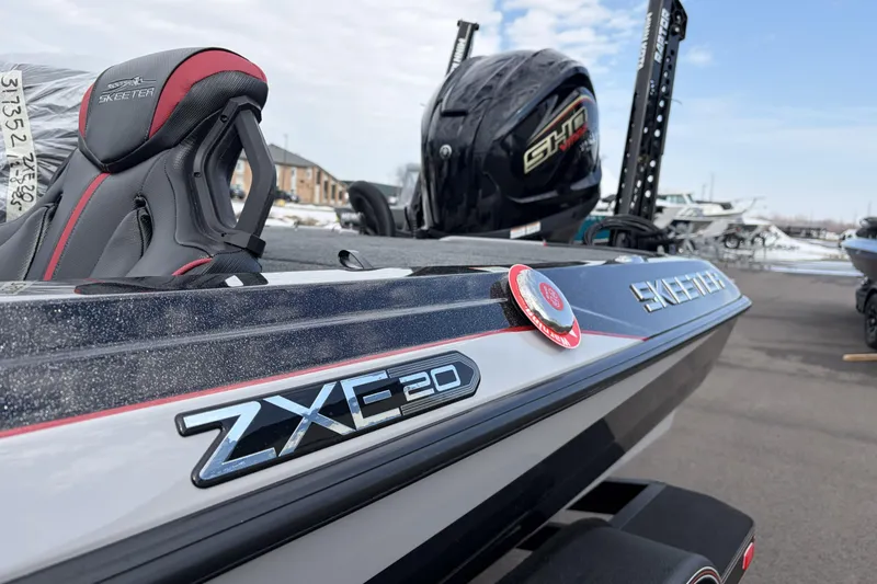 Slide: The Image of 2026 Skeeter ZXE20 boat with sleek design and modern features, displayed outdoors. - 33