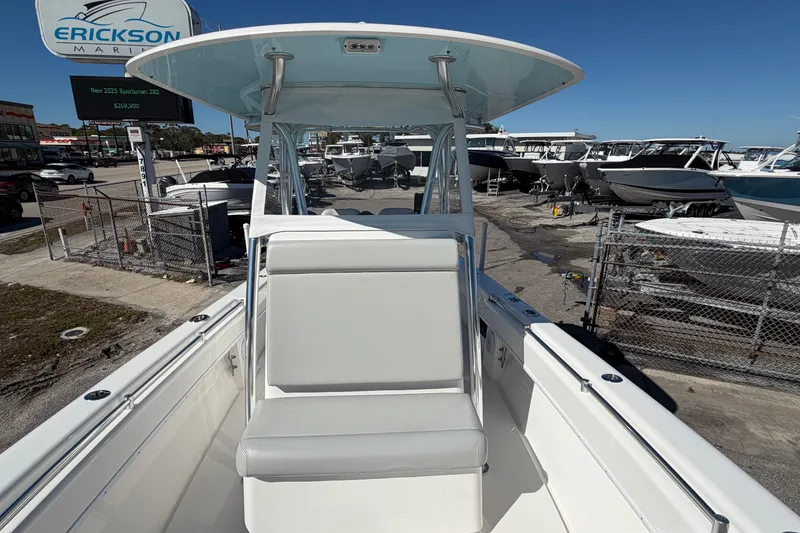 Slide: The Image of 2019 Contender 28 Tournament boat at Erickson Marine dealership, surrounded by other boats. - 10