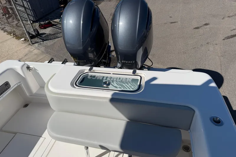Slide: The Image of 2019 Contender 28 Tournament boat with dual outboard engines and seating area. - 3