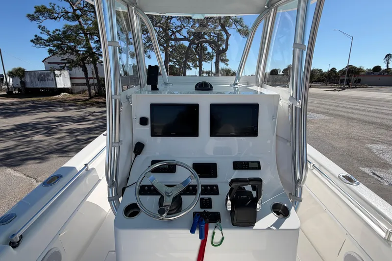 Slide: The Image of 2019 Contender 28 Tournament boat console with dual screens and steering wheel. - 5