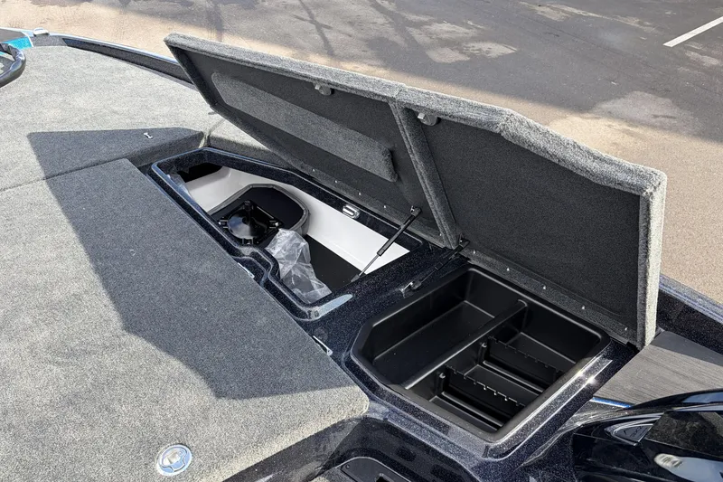 Slide: The Image of 2026 Skeeter ZXE21 boat storage compartments open, showcasing interior design and functionality. - 16