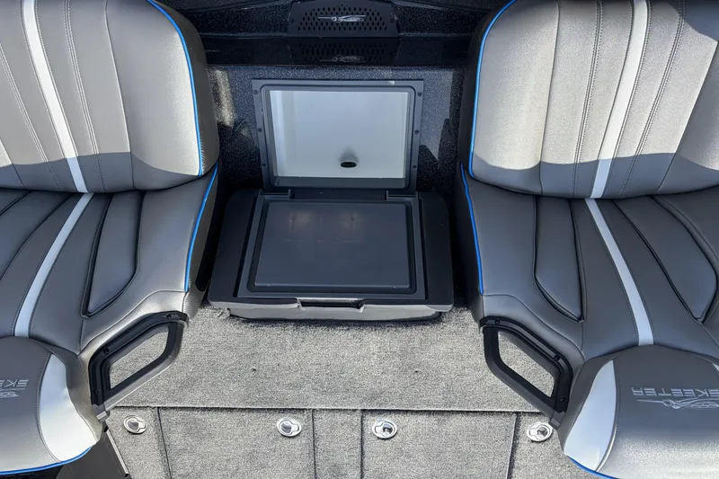 Slide: The Image of 2026 Skeeter ZXE21 boat interior with gray seats and storage compartment. - 23