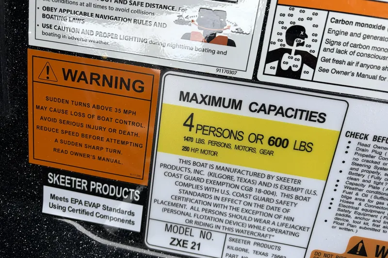 Slide: The Image of Warning and capacity labels on 2026 Skeeter ZXE21 boat, highlighting safety and weight limits. - 24
