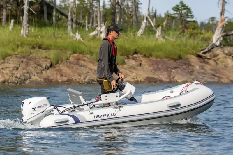 Slide: The Image of Manufacturer Provided Image: 2023 Highfield Classic 340 FCT inflatable boat on water with driver - 11