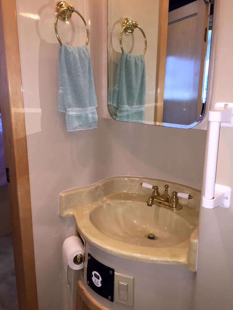 Slide: The Image of Bathroom in 1999 Bluewater 5800 with sink and mirror. - 29