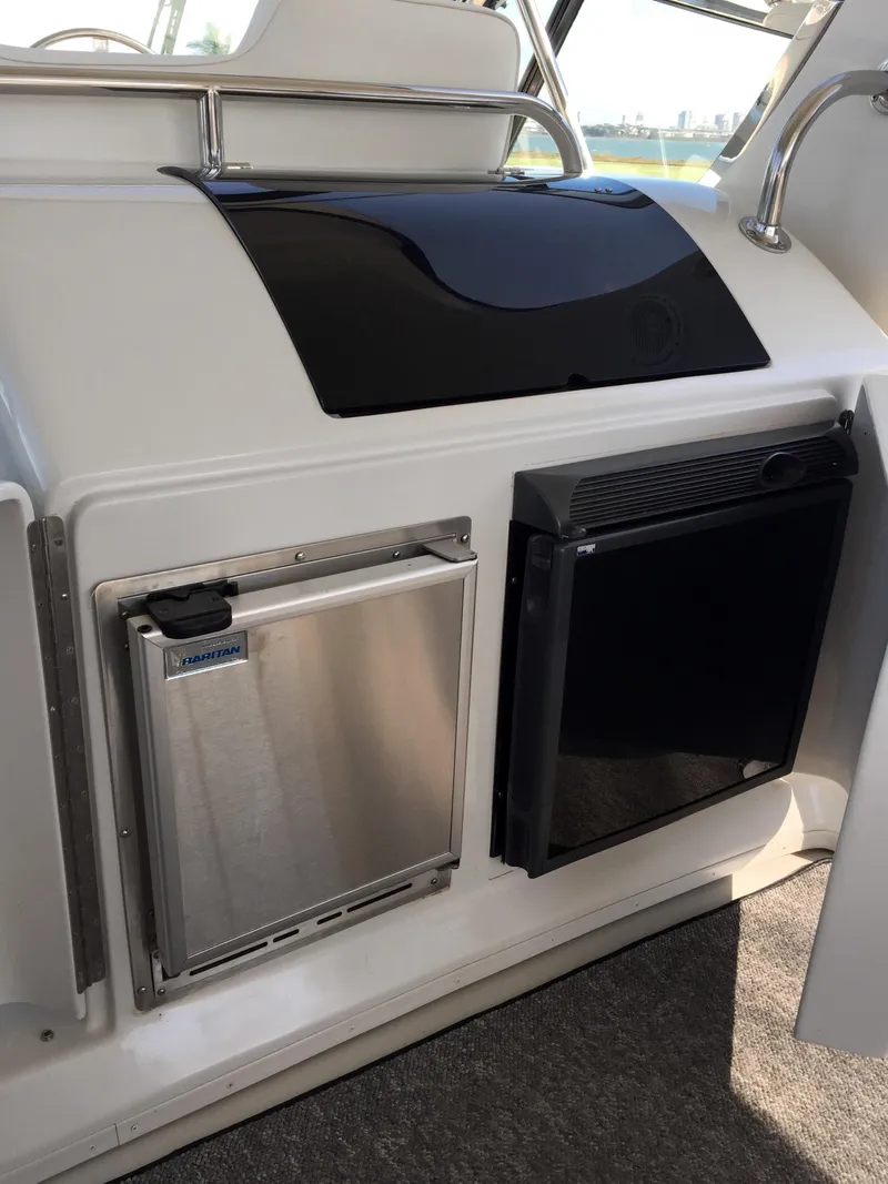 Slide: The Image of Interior of a 1999 Bluewater 5800 yacht with refrigerator. - 36