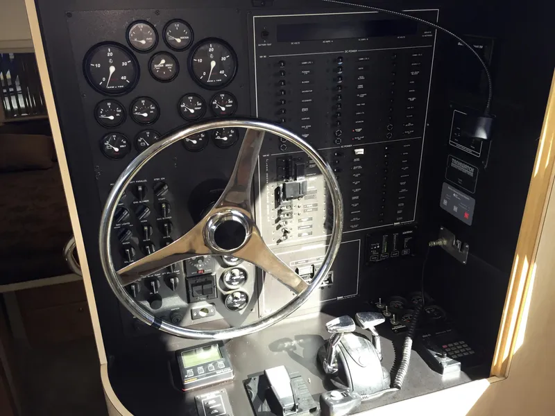 Slide: The Image of Control console of a 1999 Bluewater 5800 boat. - 42