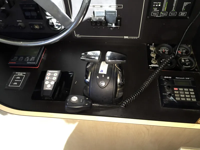 Slide: The Image of Control console of a 1999 Bluewater 5800 with various controls. - 44