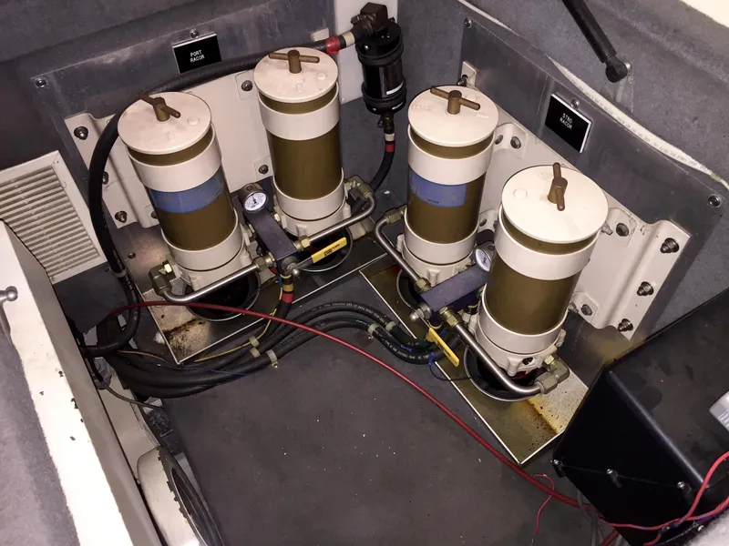 Slide: The Image of Engine room of a 1999 Bluewater 5800 with filters. - 47