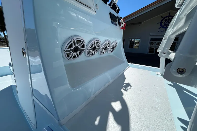 Slide: The Image of 2026 Shallow Sport 25 X3 boat interior with speaker system, showcasing sleek design. - 13