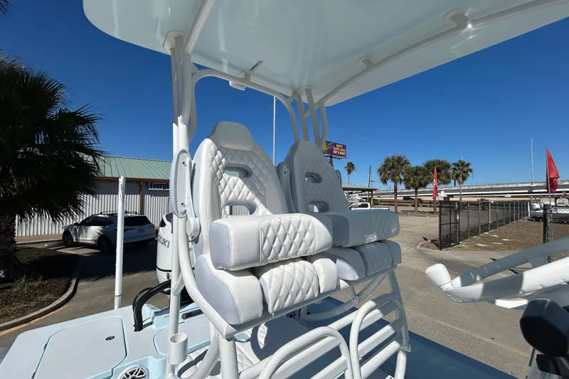 Slide: The Image of 2026 Shallow Sport 25 X3 boat with luxurious white seating. - 16