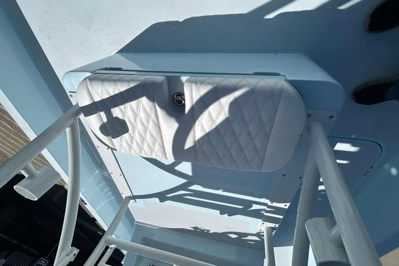 Slide: The Image of 2026 Shallow Sport 25 X3 boat seat with diamond stitching and metal frame. - 18