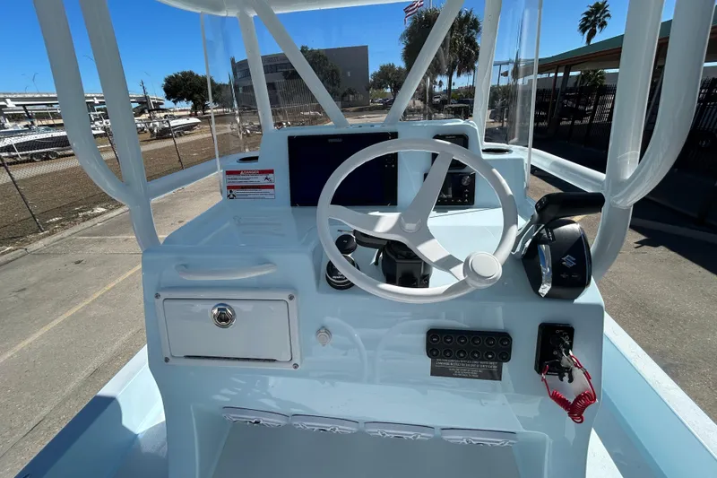 Slide: The Image of 2026 Shallow Sport 25 X3 boat console with steering wheel and controls. - 8