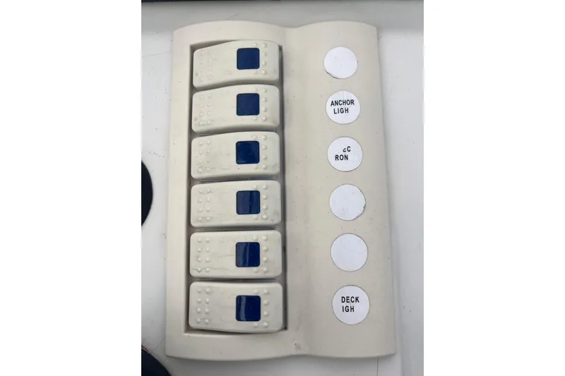 Slide: The Image of Control panel of a 1995 Wahoo 2100 EFS boat with labeled switches. - 17