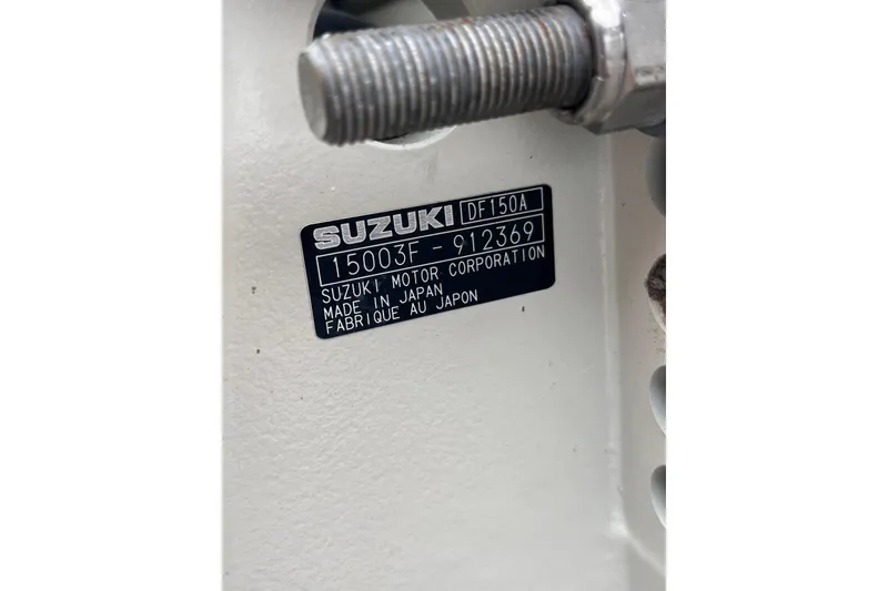 Slide: The Image of Label on Suzuki DF150A motor, serial number 15003F-912369, made in Japan. - 21