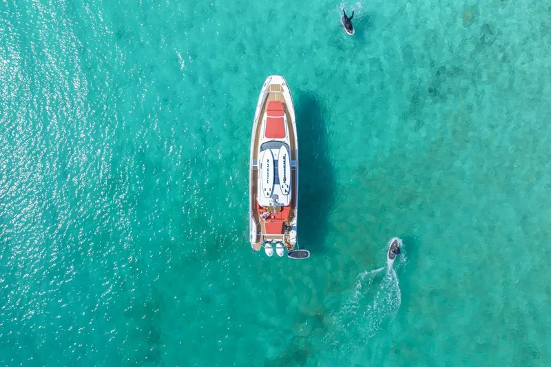 Slide: The Image of Aerial view of Nimbus Tender 11 boat in turquoise water, 2025 model. - 3