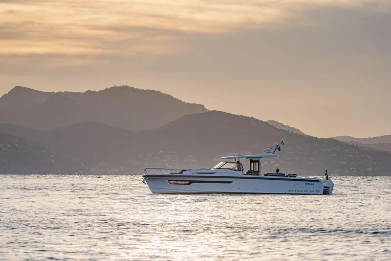 Slide: The Image of Nimbus Tender 11 boat 2025 at sunset on the sea. - 5