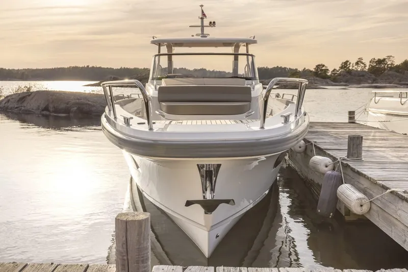 Slide: The Image of Nimbus Tender 11 boat docked at sunset, 2025 model. - 7