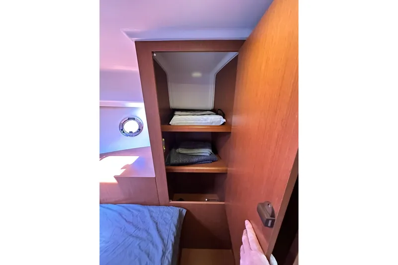 Slide: The Image of 2016 Beneteau Swift Trawler 34 docked, showcasing deck and seating area. - 10