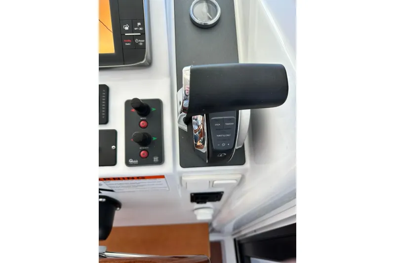 Slide: The Image of 2016 Beneteau Swift Trawler 34 cabin interior with cozy bed and wooden finish. - 25