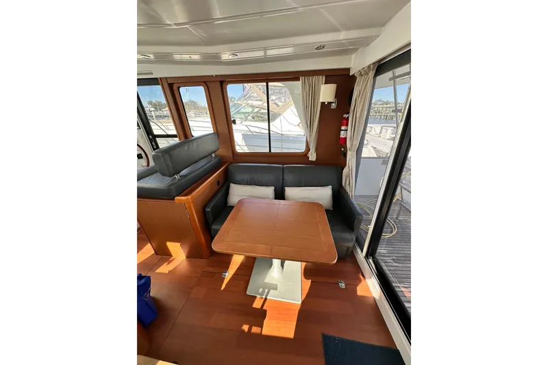 Slide: The Image of 2016 Beneteau Swift Trawler 34 cabin with bunk beds and porthole window. - 35