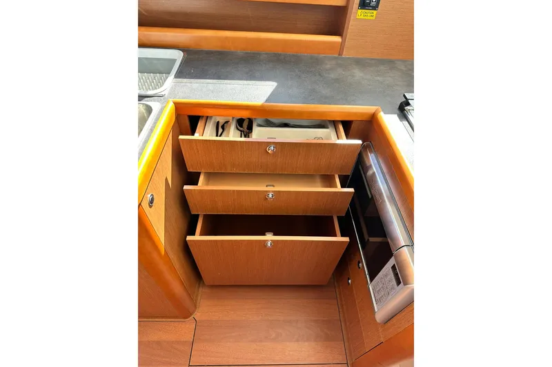 Slide: The Image of 2016 Beneteau Swift Trawler 34 cabin with bunk beds and porthole windows. - 37