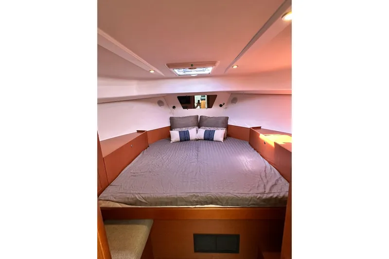 Slide: The Image of 2016 Beneteau Swift Trawler 34 docked, showcasing sleek deck and modern design. - 4