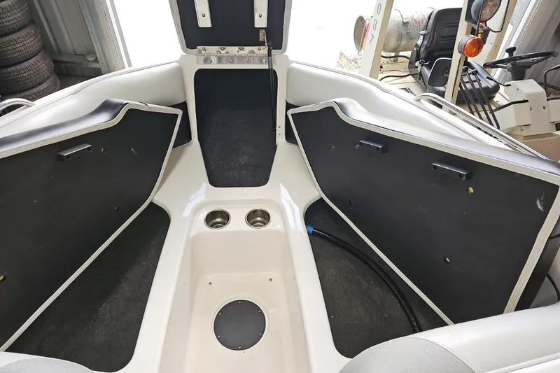 Slide: The Image of 2015 Moomba Mondo boat interior with storage compartments and cup holders. - 10