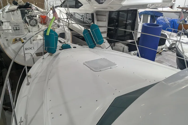 Slide: The Image of 1996 Carver 355 Aft Cabin Motor Yacht docked with other boats. - 11
