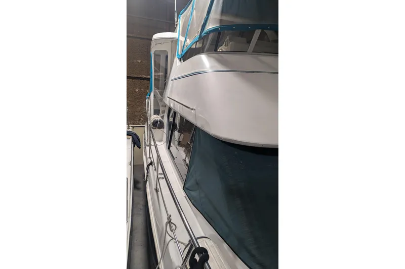 Slide: The Image of 1996 Carver 355 Aft Cabin Motor Yacht, side view in storage. - 14