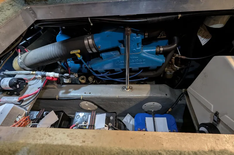 Slide: The Image of Engine compartment of a 1996 Carver 355 Aft Cabin Motor Yacht, showcasing mechanical components. - 29