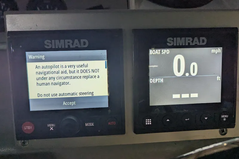 Slide: The Image of Simrad navigation display on 1996 Carver 355 Aft Cabin Motor Yacht, showing autopilot warning and speed. - 39