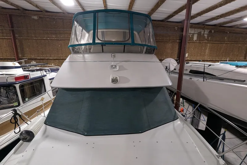 Slide: The Image of 1996 Carver 355 Aft Cabin Motor Yacht in indoor storage, front view. - 12