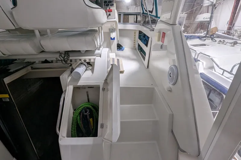 Slide: The Image of Interior view of 1996 Carver 355 Aft Cabin Motor Yacht with seating and storage. - 15