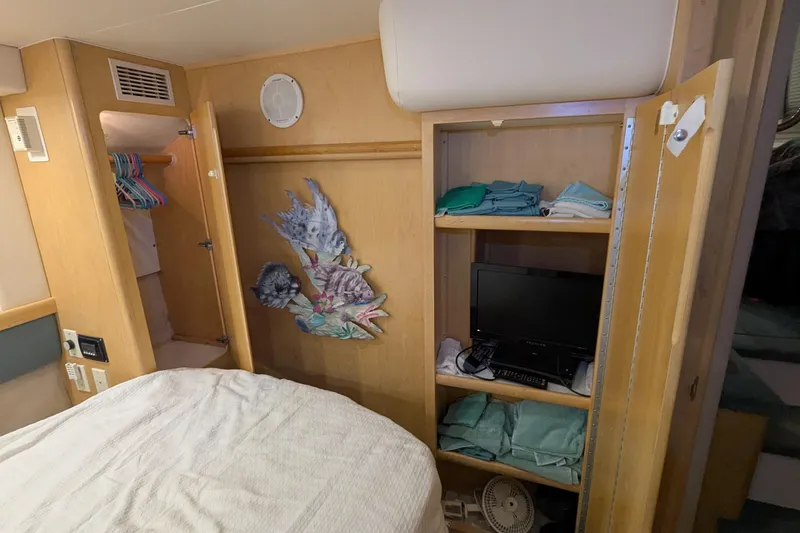 Slide: The Image of Interior of 1996 Carver 355 Aft Cabin Motor Yacht with closet and shelves. - 18