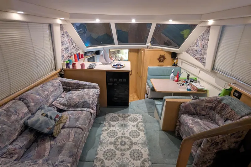 Slide: The Image of Interior of 1996 Carver 355 Aft Cabin Motor Yacht with cozy seating and dining area. - 20