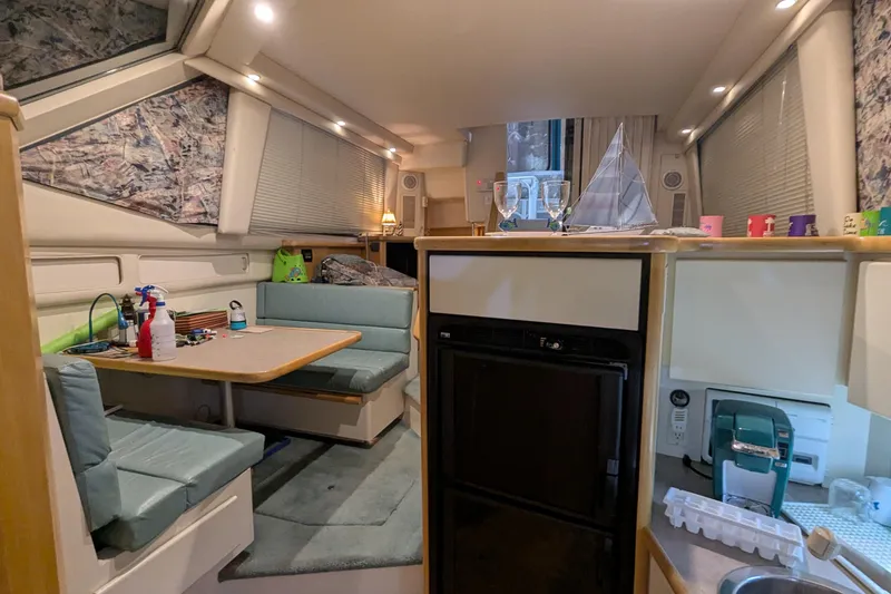 Slide: The Image of Interior of 1996 Carver 355 Aft Cabin Motor Yacht with dining area and kitchenette. - 22