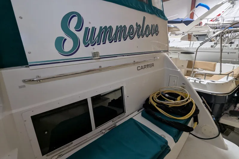 Slide: The Image of 1996 Carver 355 Aft Cabin Motor Yacht "Summerlove" docked with coiled cables. - 3