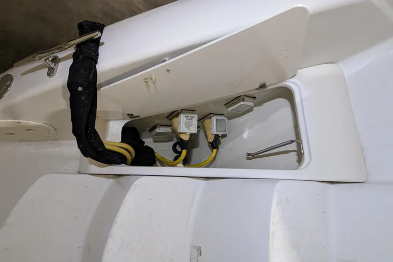 Slide: The Image of 1996 Carver 355 Aft Cabin Motor Yacht electrical compartment with cables and connectors. - 30