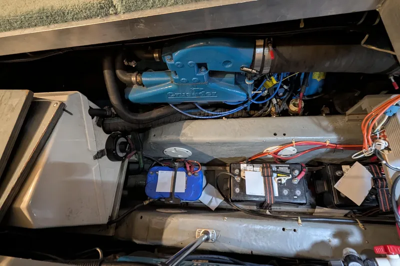 Slide: The Image of Engine compartment of a 1996 Carver 355 Aft Cabin Motor Yacht with visible batteries and wiring. - 35