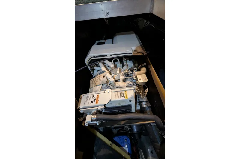Slide: The Image of Engine compartment of 1996 Carver 355 Aft Cabin Motor Yacht, showcasing mechanical components. - 36