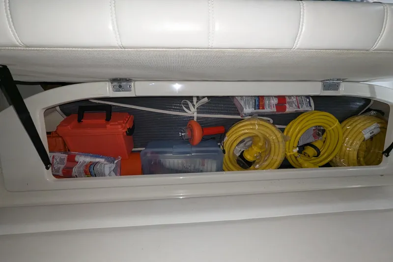 Slide: The Image of Storage compartment in a 1996 Carver 355 Aft Cabin Motor Yacht with cables and equipment. - 41
