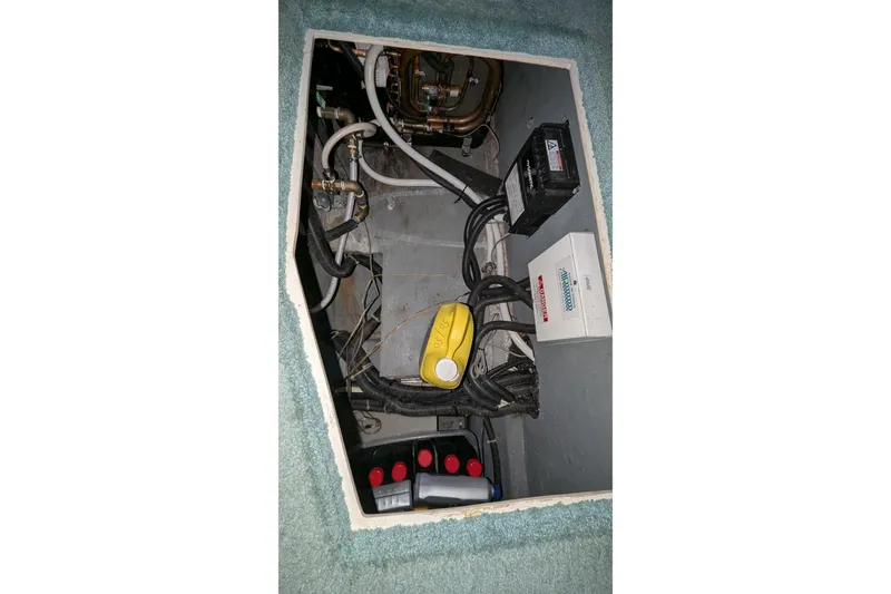 Slide: The Image of Engine compartment of 1996 Carver 355 Aft Cabin Motor Yacht with wiring and components. - 43