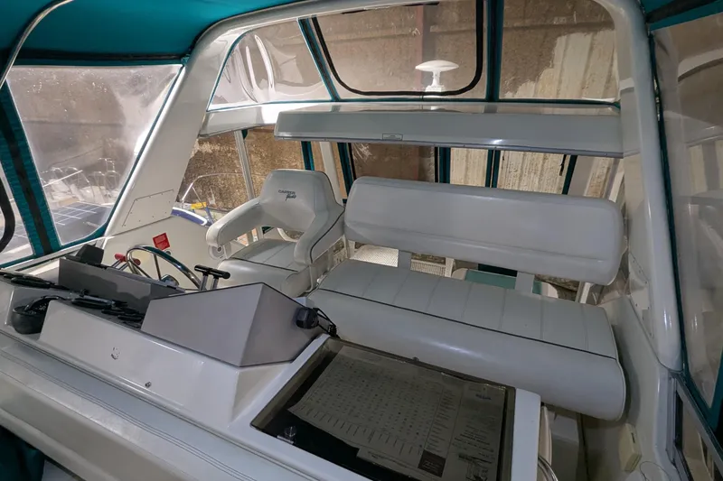 Slide: The Image of Interior of 1996 Carver 355 Aft Cabin Motor Yacht with helm and seating area. - 7