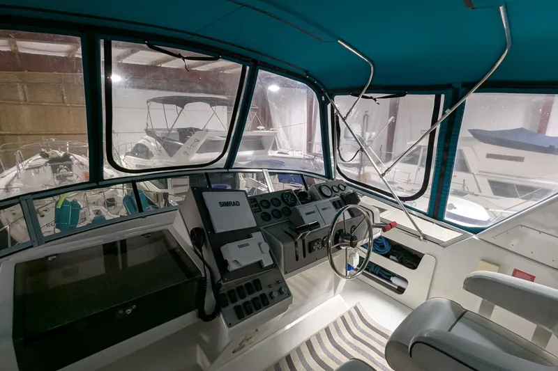 Slide: The Image of Interior helm of 1996 Carver 355 Aft Cabin Motor Yacht with navigation equipment. - 8