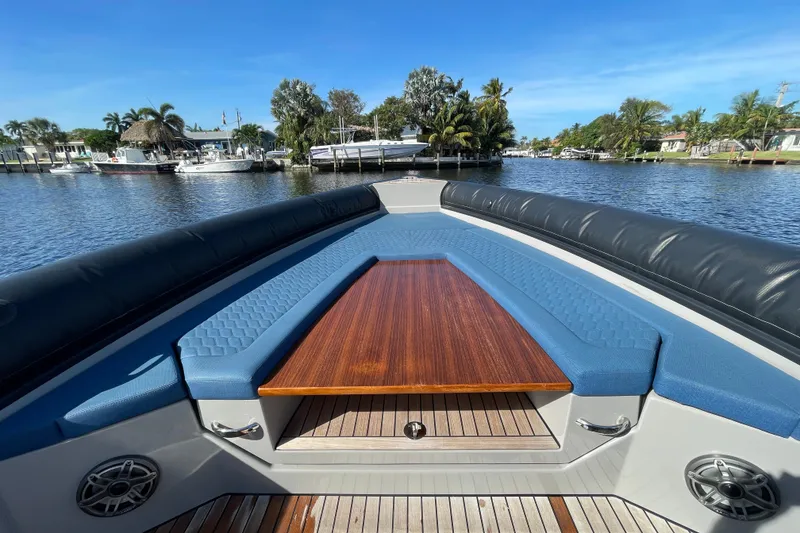 Slide: The Image of Luxurious Skipper-BSK 38 boat interior with blue seating and wooden table, 2023 model. - 17
