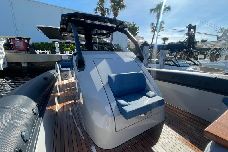 Slide: The Image of 2023 Skipper-BSK BSK 38 boat with sleek design and comfortable seating, docked under sunny skies. - 22