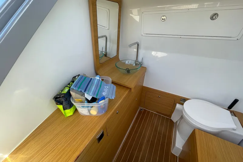 Slide: The Image of Modern bathroom interior on Skipper-BSK 38 boat, featuring wood accents and compact design. - 25