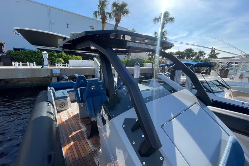 Slide: The Image of 2023 Skipper-BSK BSK 38 boat docked, featuring sleek design and modern seating. - 28